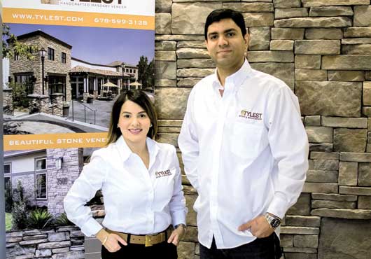 TYLEST Masonry Veneer Co-Owners Alex and Ediana Ponciano in the TYLEST showroom in Cumming, Georgia.